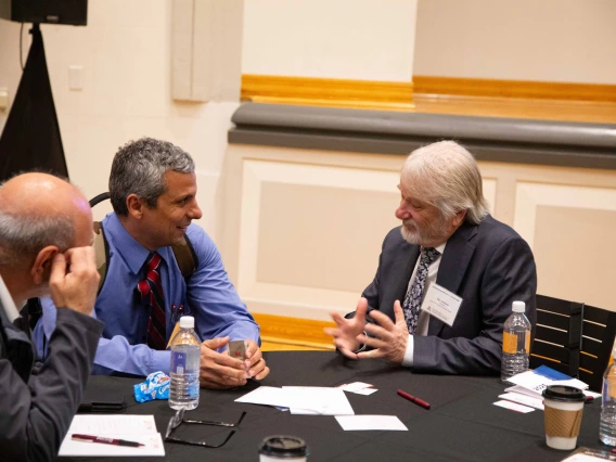 Dan Derksen speaking with guests