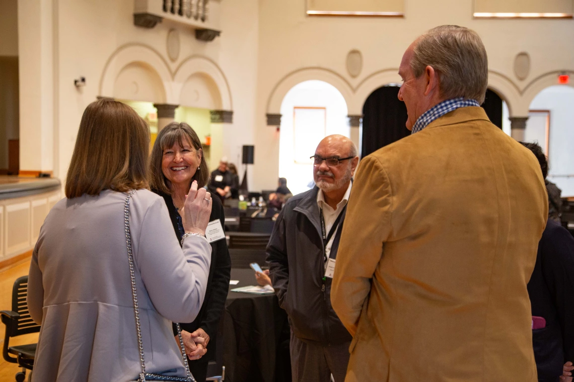 Nancy Johnson talks with Jennifer Smith and others
