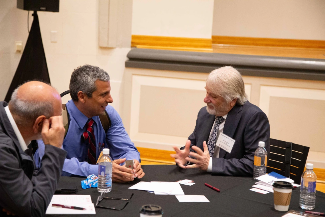 Dan Derksen speaking with guests