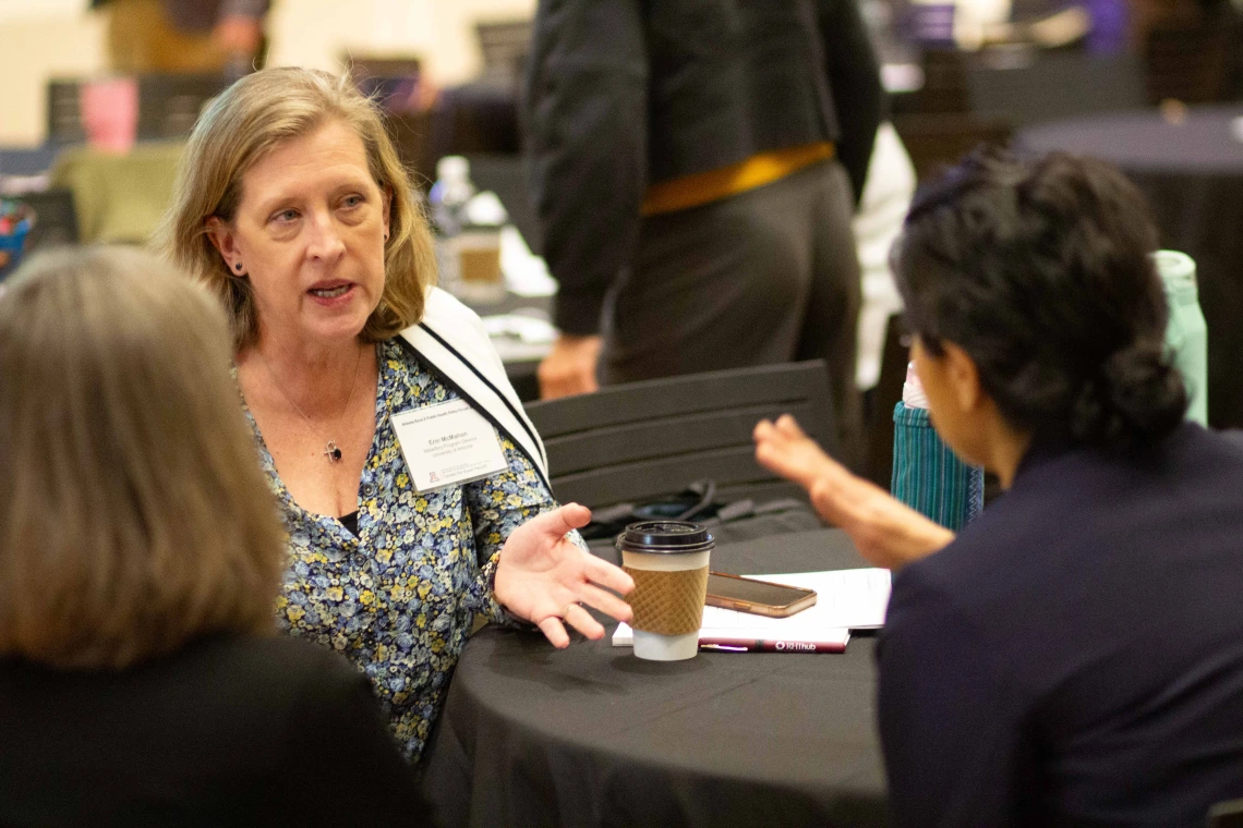Erin McMahon talks with Nancy Johnson and Salma Patel